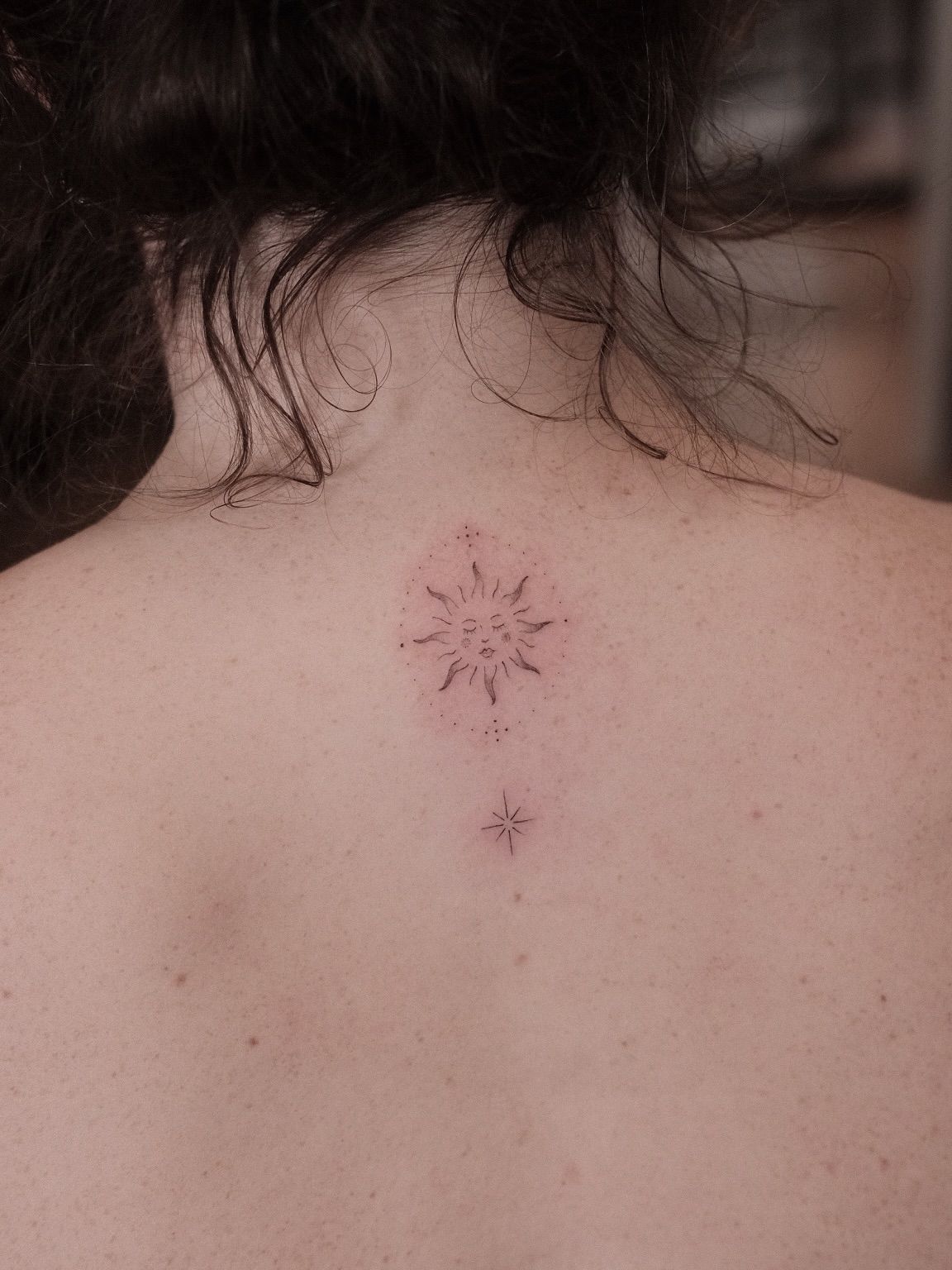 Red ink sun star at the base of the neck